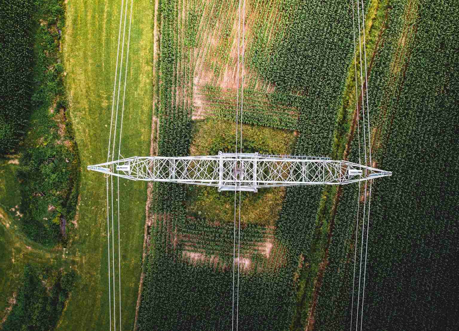 Aerial view of electrical wires large scale power energy tower