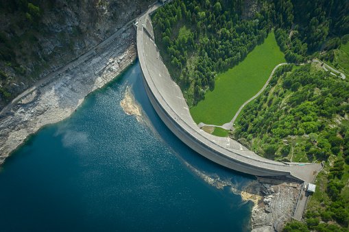Aerial view of bridge on large dam in Swiss Alps